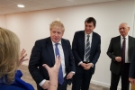 Boris Johnson standing next to John
