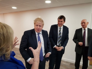 Boris Johnson standing next to John